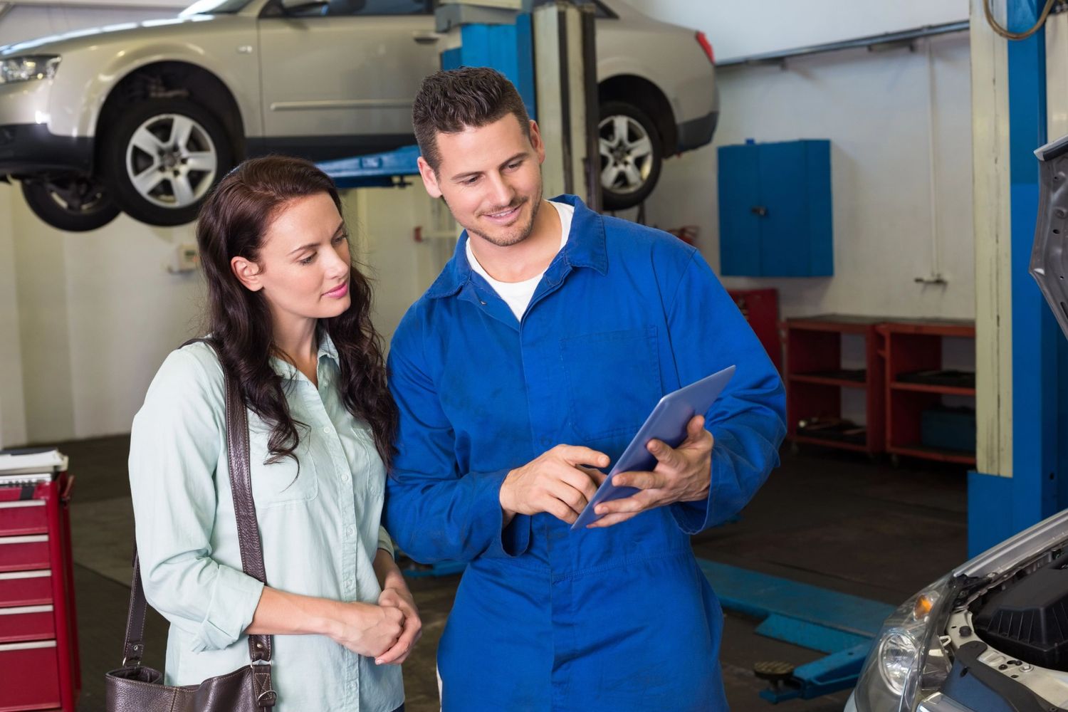 Technician performing Ford third-party car inspection for a client in Houston TX