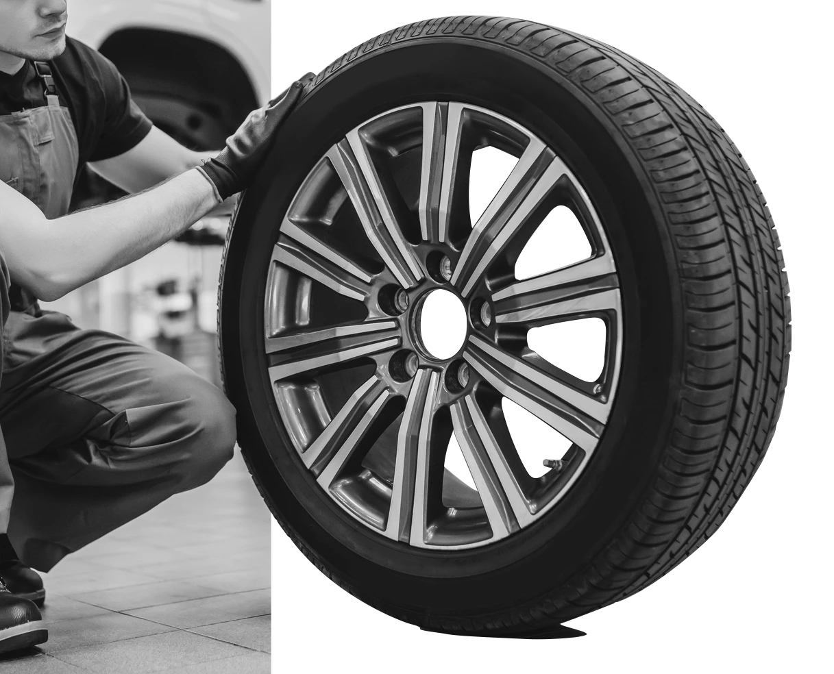Mobile auto inspection Houston — inspector measuring tire tread depth during 200-point pre purchase check