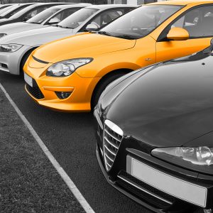 The perfect new car of your choice selected from a row of different european marques of used cars for retail sale on a motor dealers forecourt all logos removed