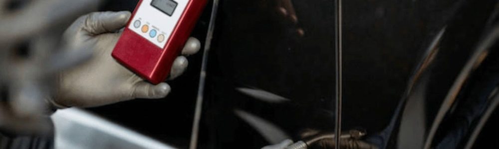 Mechanic inspection before buying car Houston — using paint thickness meter to detect prior accident repairs